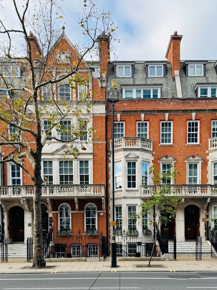 Traditional brick townhouses in London, showcasing iconic British architecture.